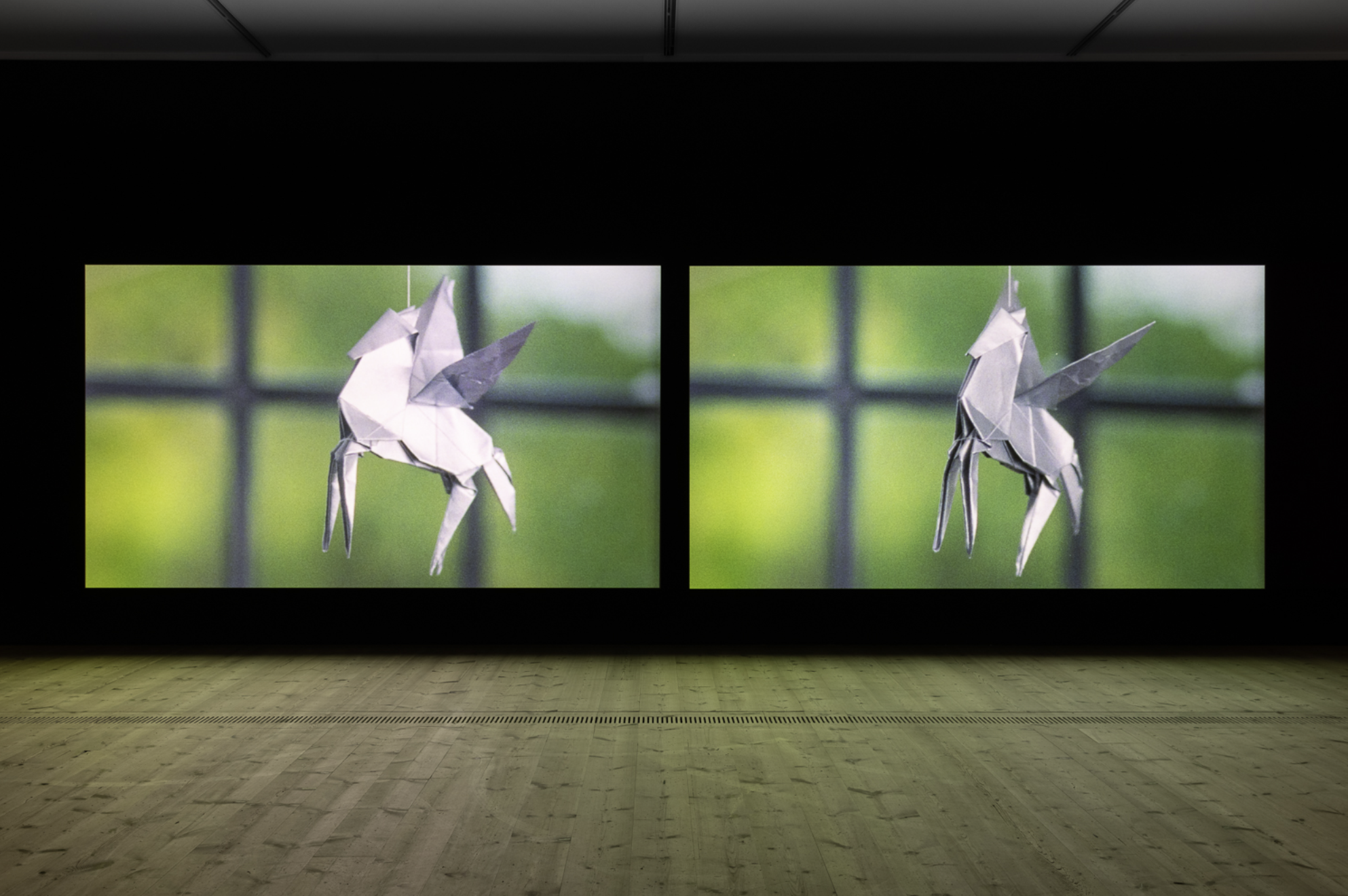 Birdsong - Two-channel video installation showing origami pegasus figures